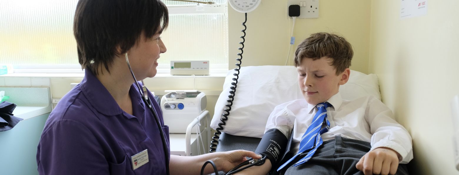 child having blood pressure checked