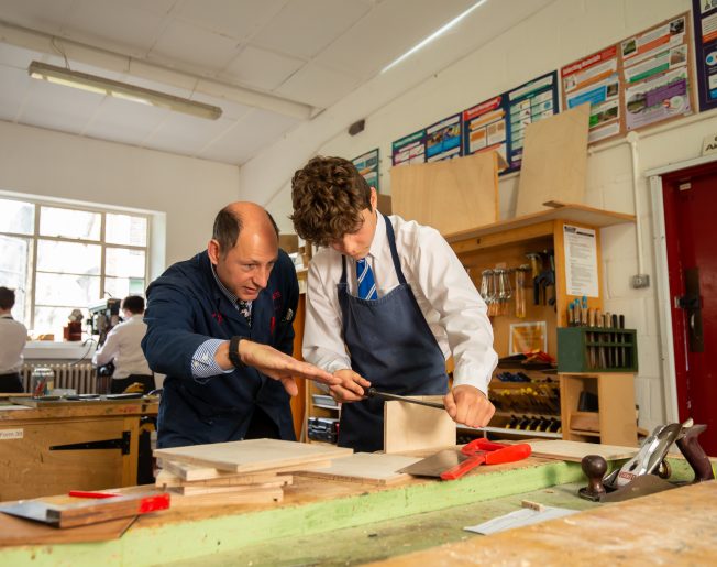 boy in a woodwork lesson