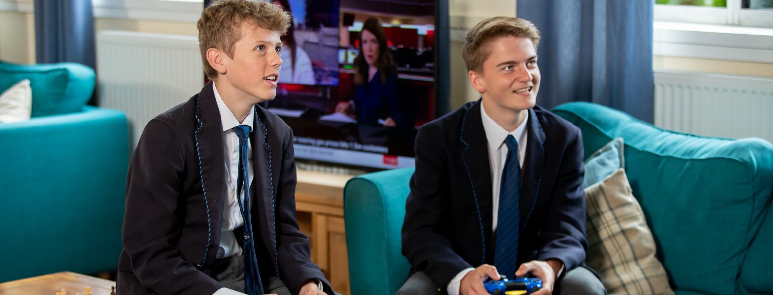 2 boys playing a video game